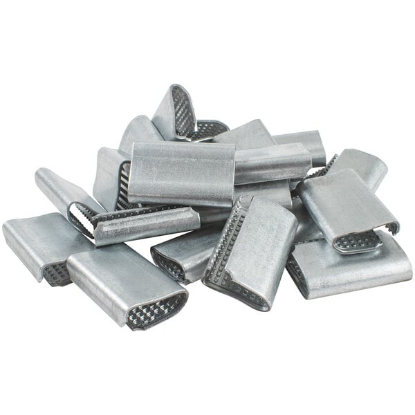 Open serrated poly strapping seals, silver metal, assorted seals in pile